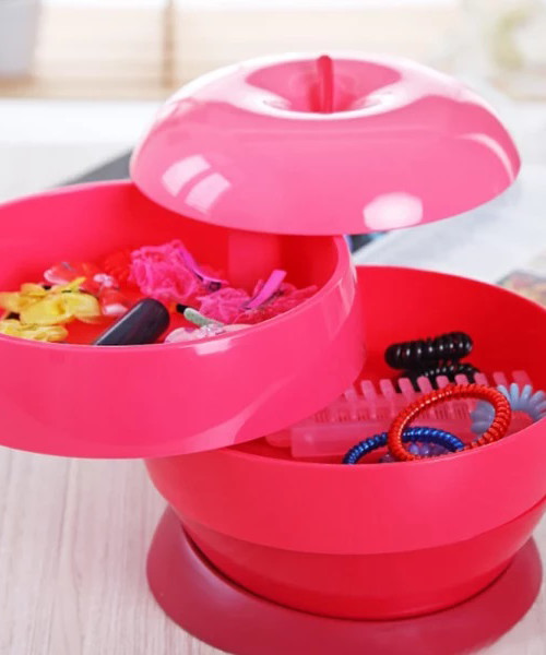 Platzsparender Behälter in Form eines Apfels